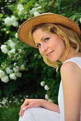 Image showing Young woman resting in garden