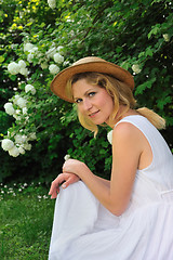 Image showing Young woman resting in garden