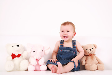 Image showing Lovely baby girl with toys