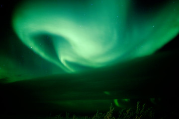 Image showing Aurora Swirl growing from behind cloud