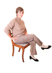 Image showing Lady sitting on chair.