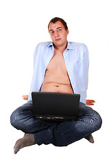 Image showing Teen with laptop and open shirt.