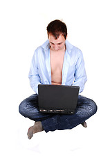 Image showing Teen with laptop and open shirt.