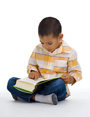 Image showing cute boy reading a book