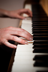 Image showing Woman playing piano