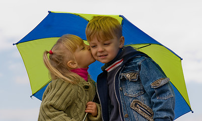 Image showing Little boy and girl with umbrella