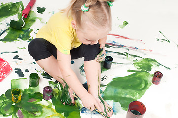 Image showing Little girl painting