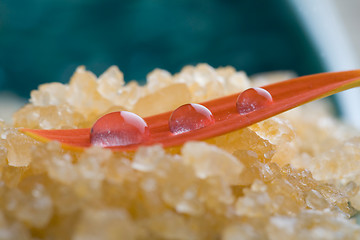 Image showing Bath salt with water droplets on flower petal