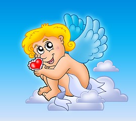 Image showing Cupid with heart on blue sky