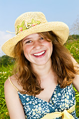 Image showing Portrait of young girl smiling in meadow