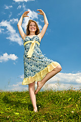 Image showing Young girl dancing in meadow