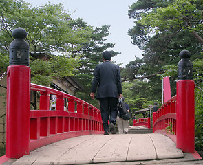 Image showing Businessman on a bridge