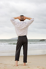 Image showing Businessman relaxing on beach