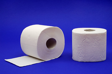 Image showing Two rolls of toilet paper on a blue background