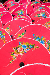 Image showing Hand painted pink umbrellas in Thailand