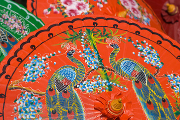 Image showing Hand painted orange umbrellas in Thailand