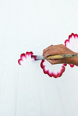 Image showing Hand painting flowers on white fabric