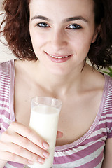 Image showing Young people eating milk with cereals