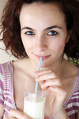 Image showing Young people eating milk with cereals