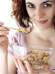 Image showing Young people eating milk with cereals