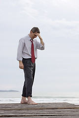 Image showing Worried businessman at the sea