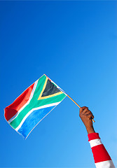Image showing Black hand with South African flag