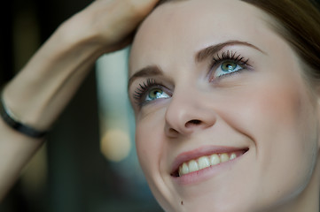 Image showing Woman applying makeup