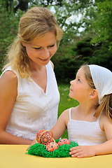 Image showing Young mother and daughter having Easter time