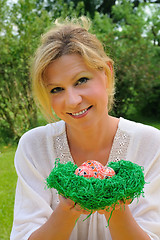 Image showing Young woman and easter eggs