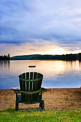 Image showing Wooden chair at sunset on beach