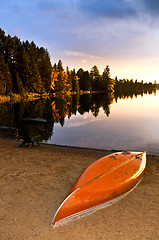 Image showing Lake sunset with canoe on beach