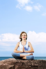 Image showing Young girl meditating outdoors