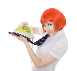 Image showing happy woman ironing tie 