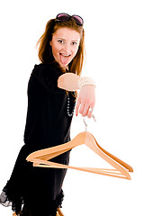 Image showing Woman holding hanger with tongue hang on