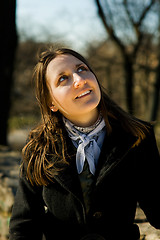 Image showing young woman looking up