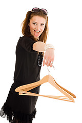 Image showing Crazy woman on sale holding hanger