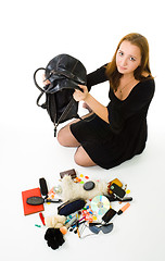 Image showing Woman looking in her hand bag