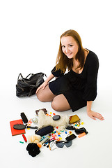 Image showing Woman with accessories from woman handbag