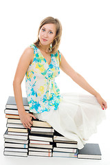 Image showing woman sitting on books