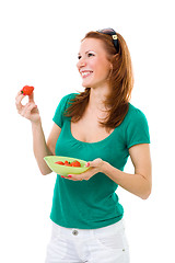 Image showing Woman eating strawberry