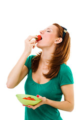 Image showing woman eating strawberry