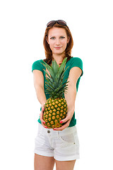 Image showing woman offering pineapple