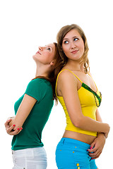 Image showing Two women friends standiing together back to back