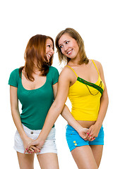Image showing Two happy young women friends walk together