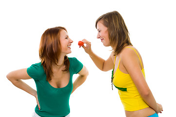 Image showing Two woman with strawberry