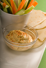 Image showing hummus dip with pita bread and vegetable