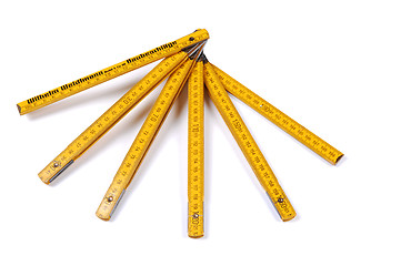 Image showing Yellow wooden ruler.