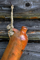 Image showing Old Ceramic Bottle On The Wall