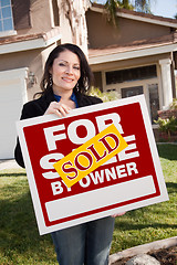 Image showing Hispanic Woman Holding Sold For Sale By Owner Real Estate Sign I