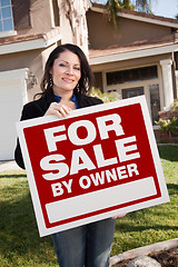 Image showing Hispanic Woman Holding For Sale By Owner Real Estate Sign In Fro